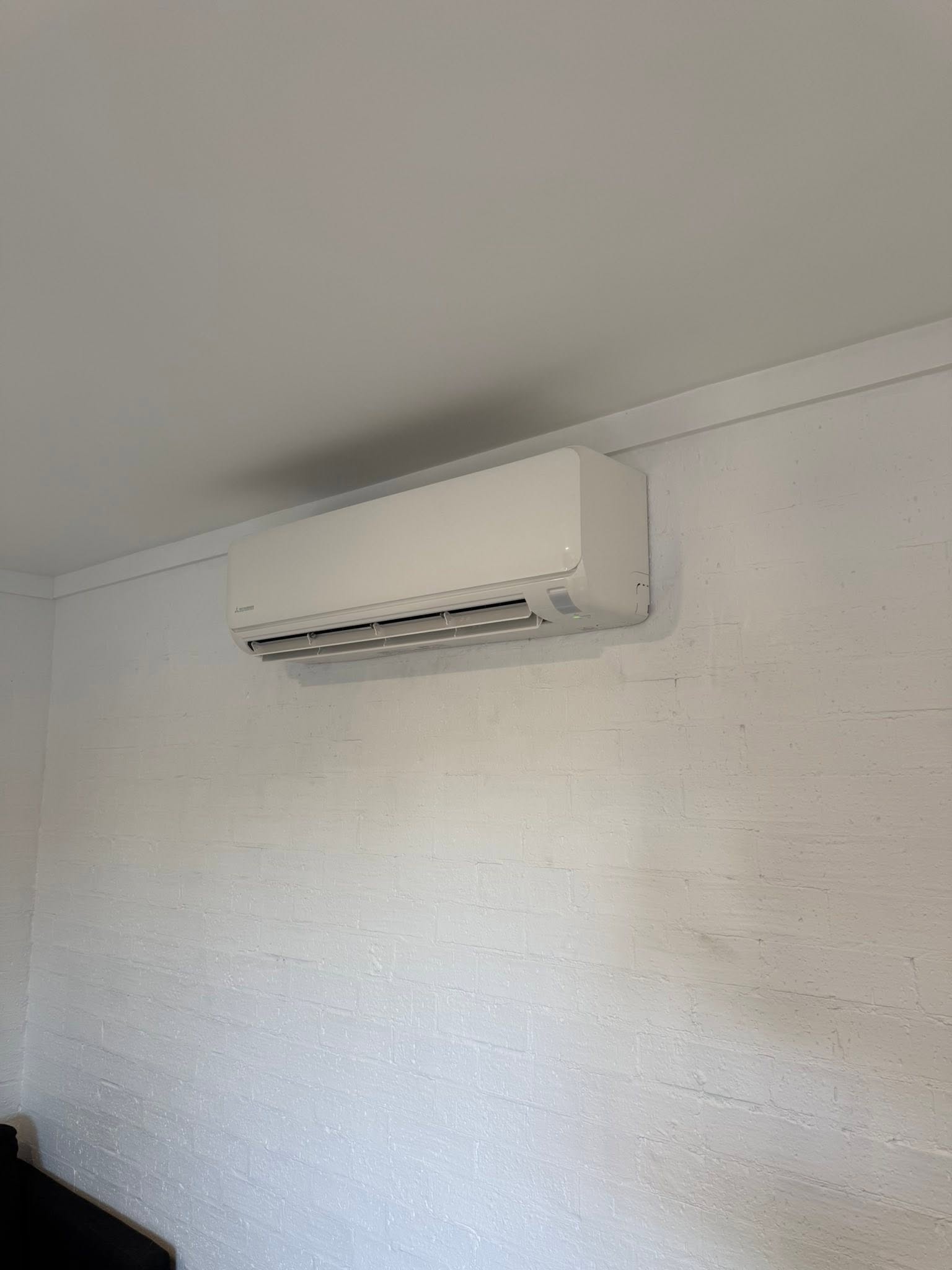 FHC install: split system above a lounge in a coastal Coffs Harbour home